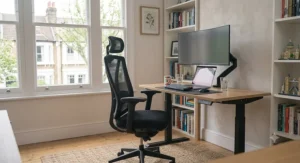 Full home study setup featuring a high-spec ergonomic office chair paired with an electric height-adjustable standing desk.